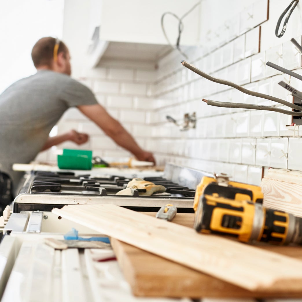 A man working on a kitchen renovation